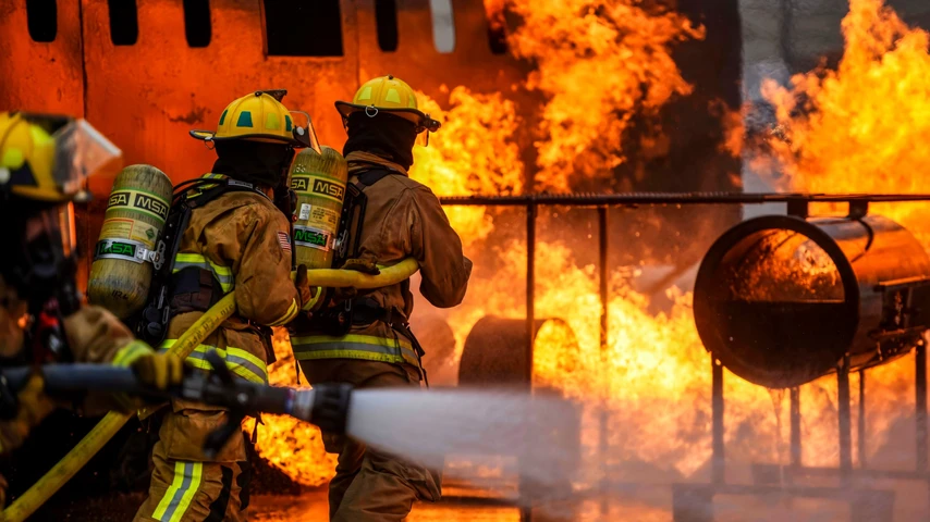 firefighters fighting large fire